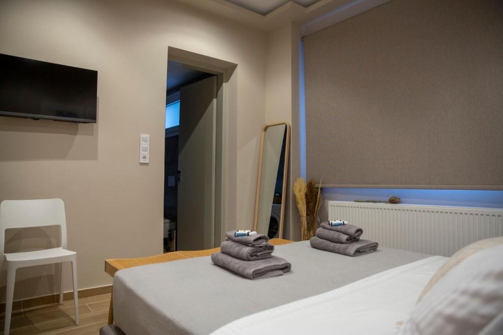 Postel nebo postele na pokoji v ubytování Nerissa Seafront apartment