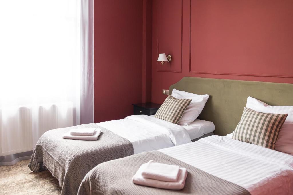Posteľ alebo postele v izbe v ubytovaní Hotel Mały Młyn