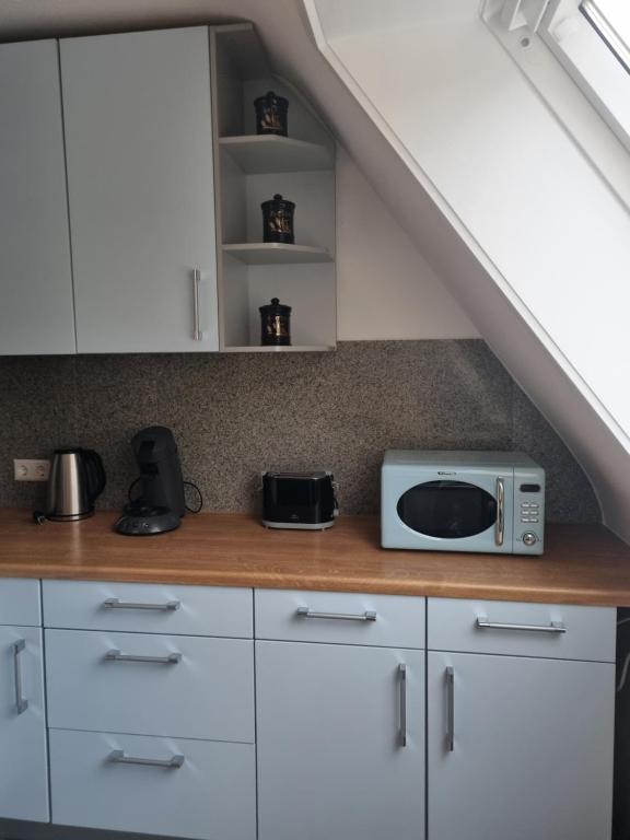 Kuchyň nebo kuchyňský kout v ubytování Renatas Ferienwohnung ISABEL