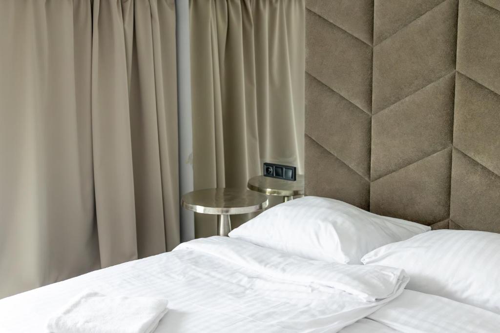 Posteľ alebo postele v izbe v ubytovaní Hotel Mały Młyn