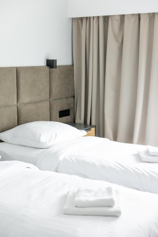 Posteľ alebo postele v izbe v ubytovaní Hotel Mały Młyn