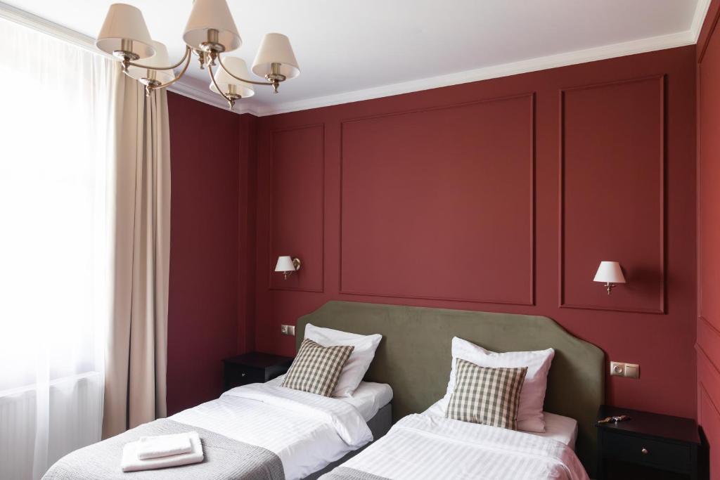 Posteľ alebo postele v izbe v ubytovaní Hotel Mały Młyn