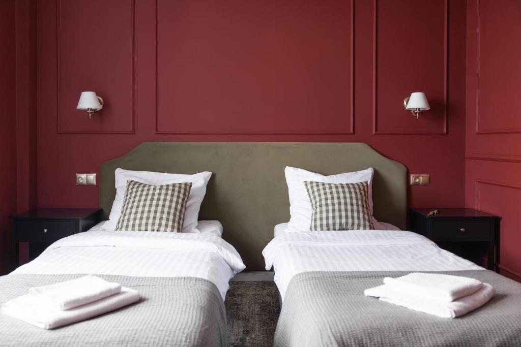 Posteľ alebo postele v izbe v ubytovaní Hotel Mały Młyn
