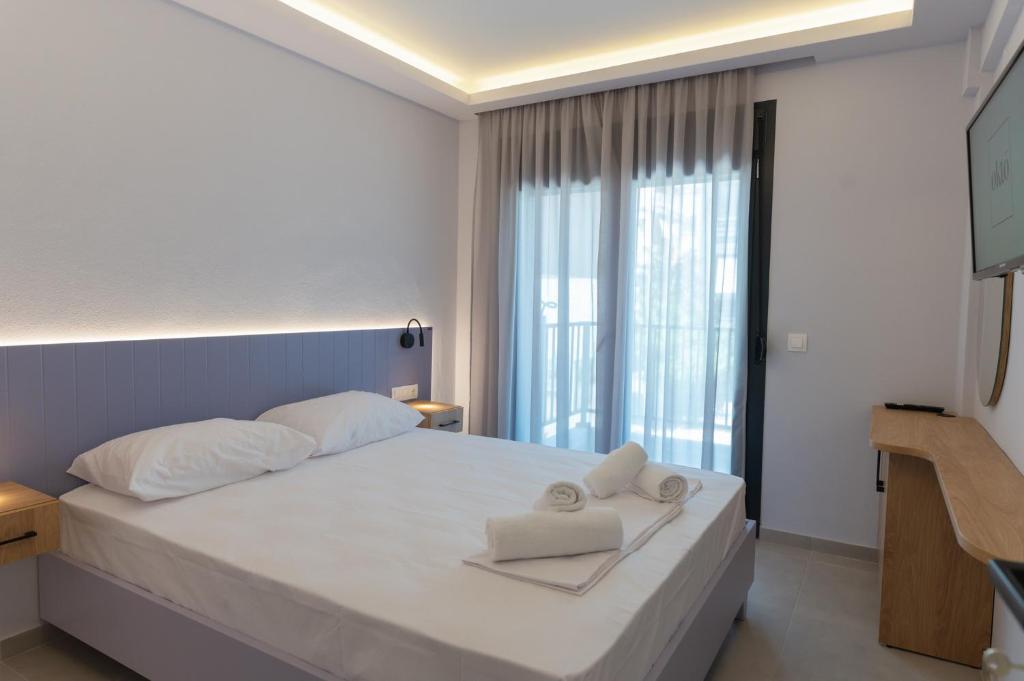 Postel nebo postele na pokoji v ubytování Oktolia suites