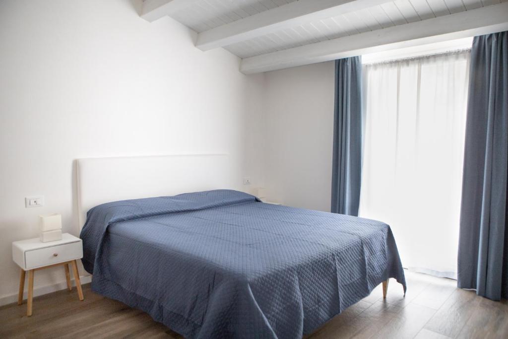 A bed or beds in a room at CASA MAIOLICA