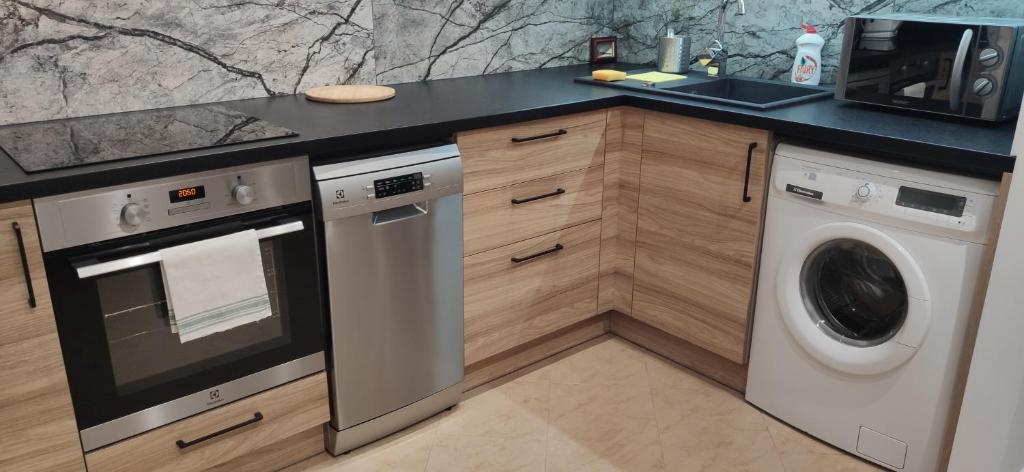 Kuchyňa alebo kuchynka v ubytovaní Apartment Jerzmanowskiego Krakow