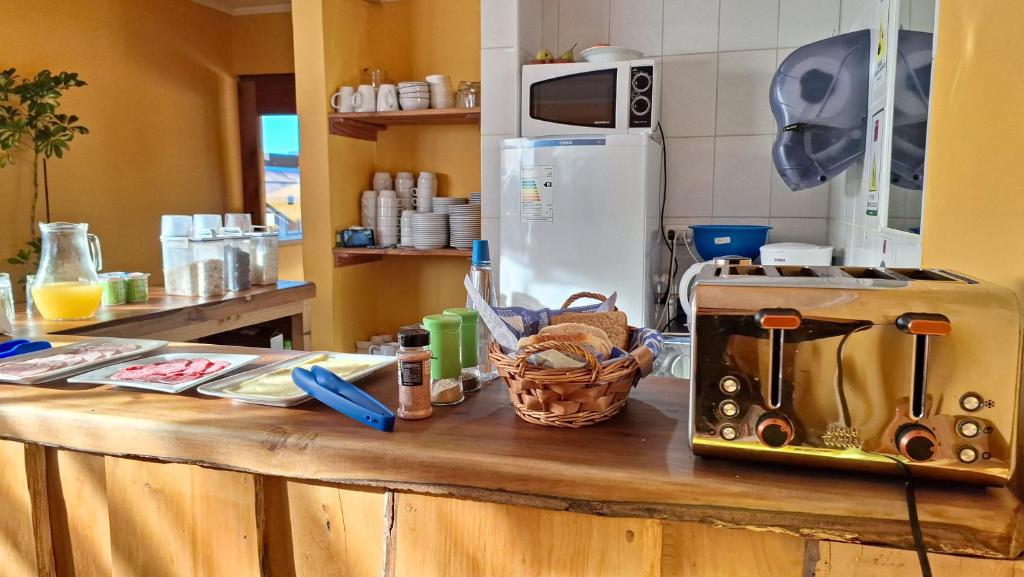 A cozinha ou kitchenette de Alpes Hotel