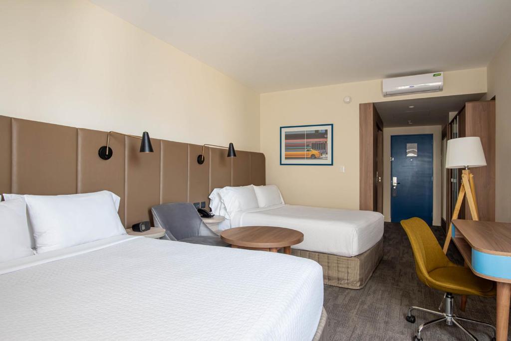 Voodi või voodid majutusasutuse Crowne Plaza Lima by IHG toas