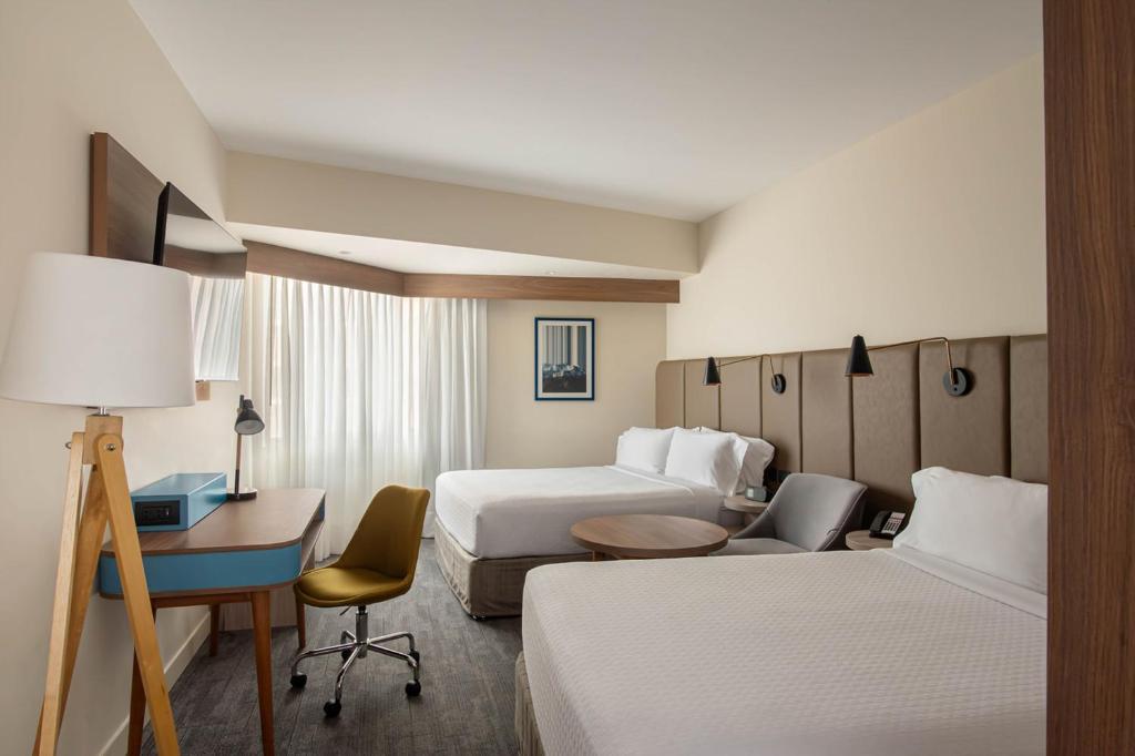 Voodi või voodid majutusasutuse Crowne Plaza Lima by IHG toas