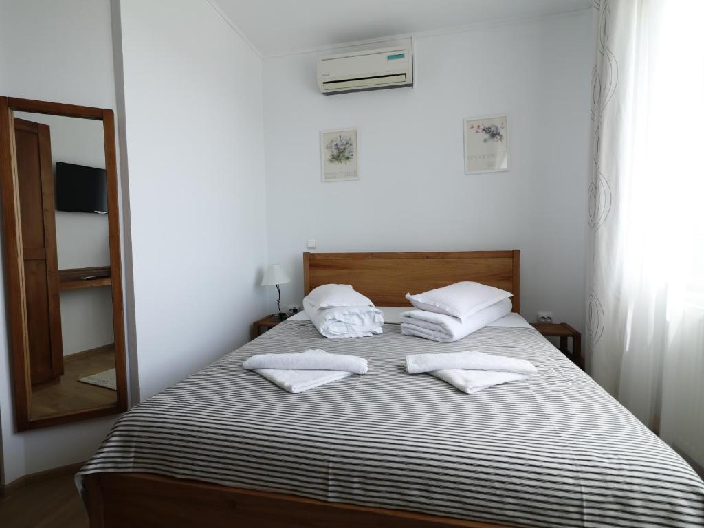 Postel nebo postele na pokoji v ubytování Casa Colinelor