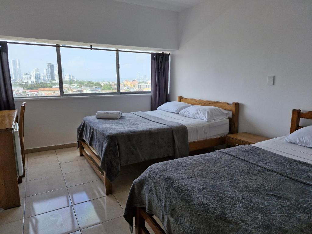 Postel nebo postele na pokoji v ubytování Hotel Stil Cartagena