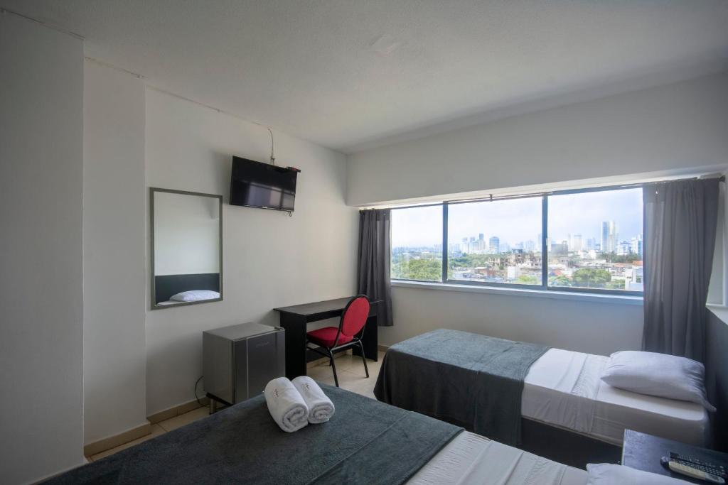 Postel nebo postele na pokoji v ubytování Hotel Stil Cartagena