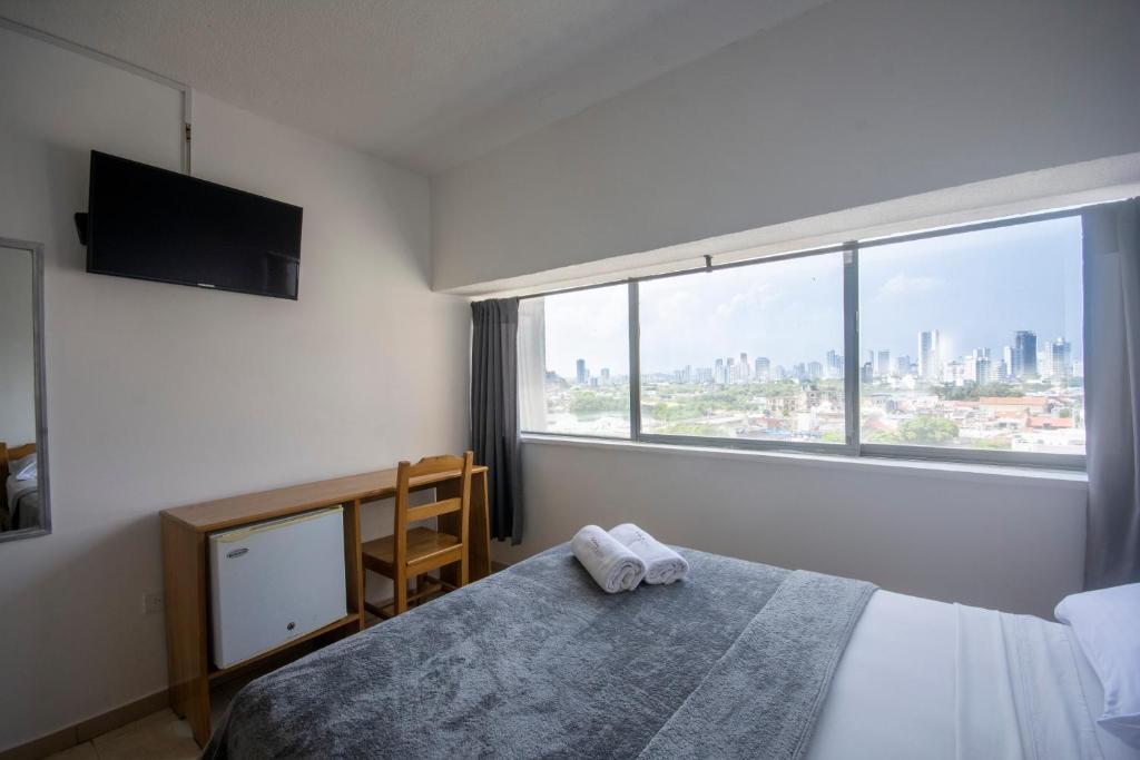 Postel nebo postele na pokoji v ubytování Hotel Stil Cartagena