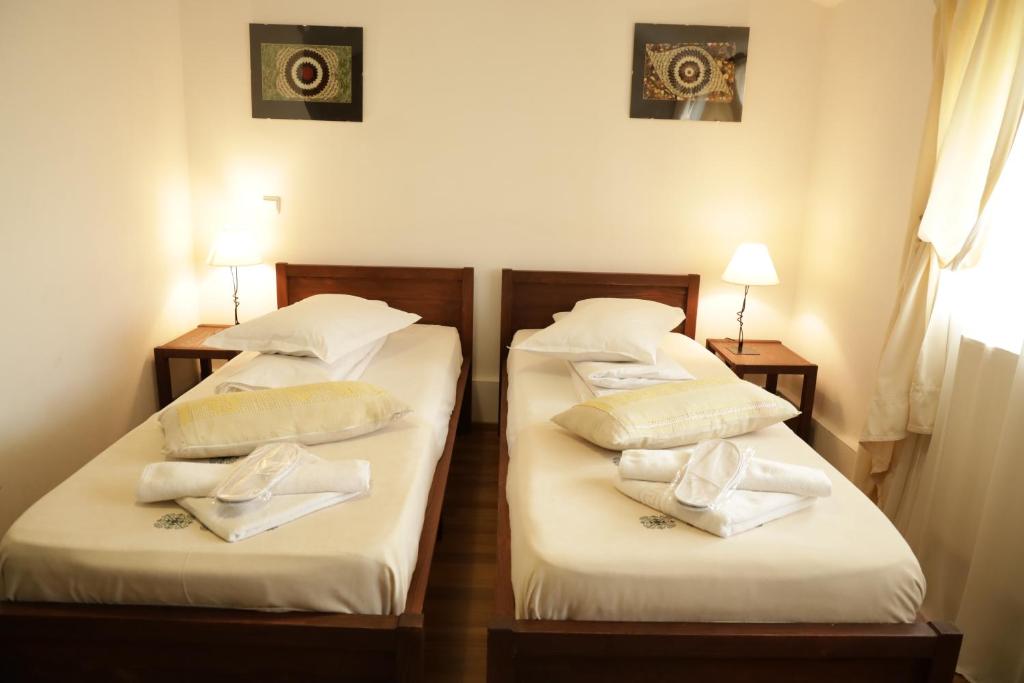 Postel nebo postele na pokoji v ubytování Casa Colinelor