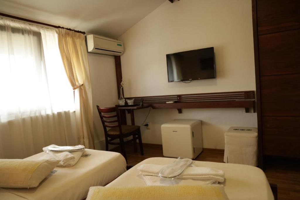 Postel nebo postele na pokoji v ubytování Casa Colinelor