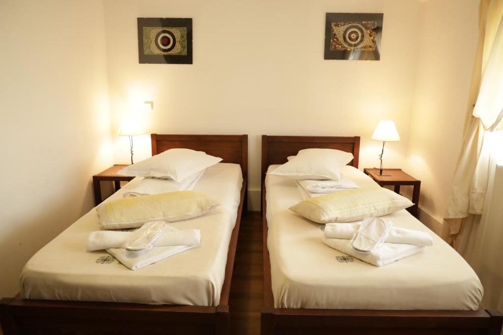 Postel nebo postele na pokoji v ubytování Casa Colinelor