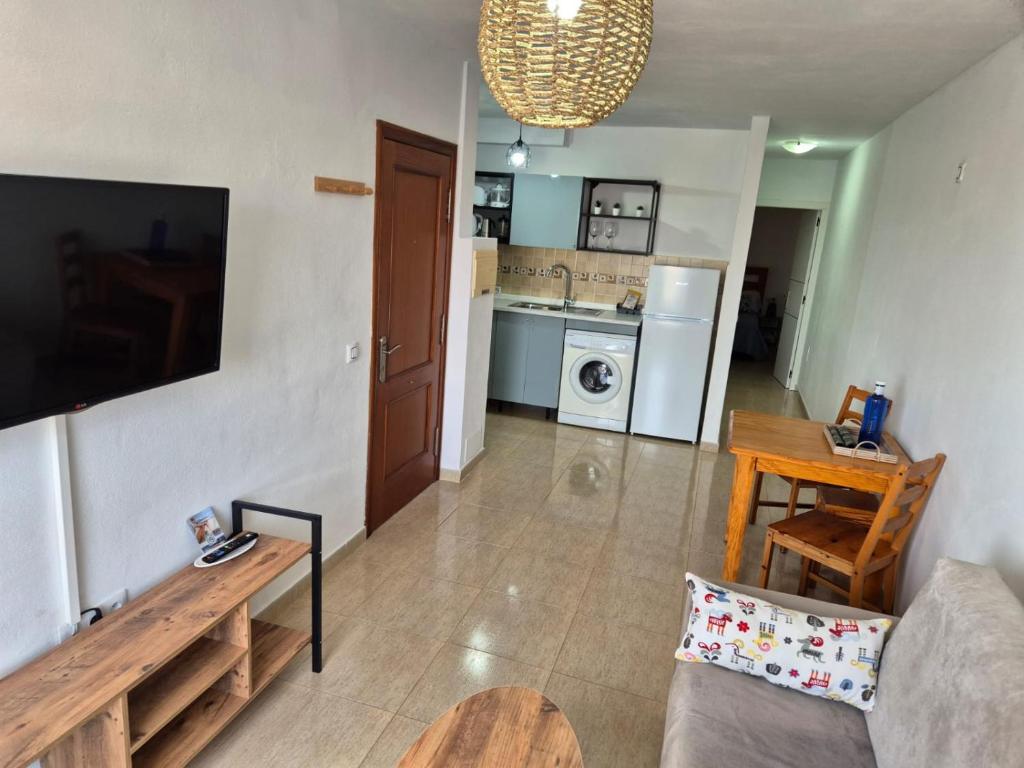 Kuchyň nebo kuchyňský kout v ubytování Apartamentos Cotillo Family