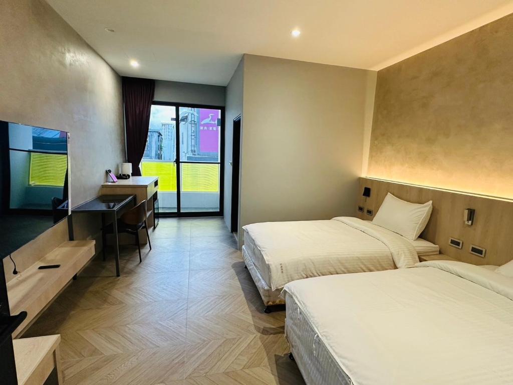Postel nebo postele na pokoji v ubytování Tai Dong Jin Kuai Homestay