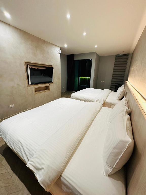 Postel nebo postele na pokoji v ubytování Tai Dong Jin Kuai Homestay