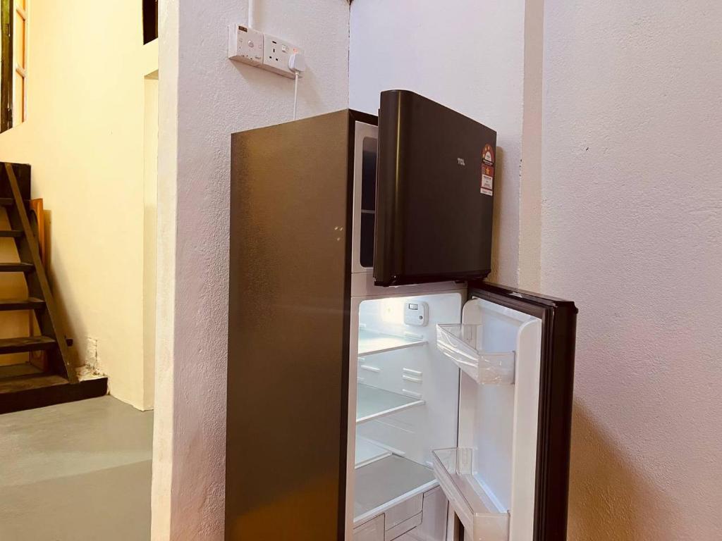 Kuchyň nebo kuchyňský kout v ubytování Inap Desa R'Sawit Pintu A