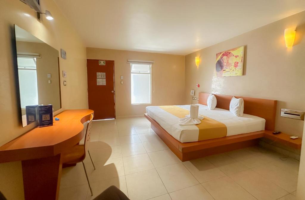Postel nebo postele na pokoji v ubytování Auto Hotel Mediterráneo