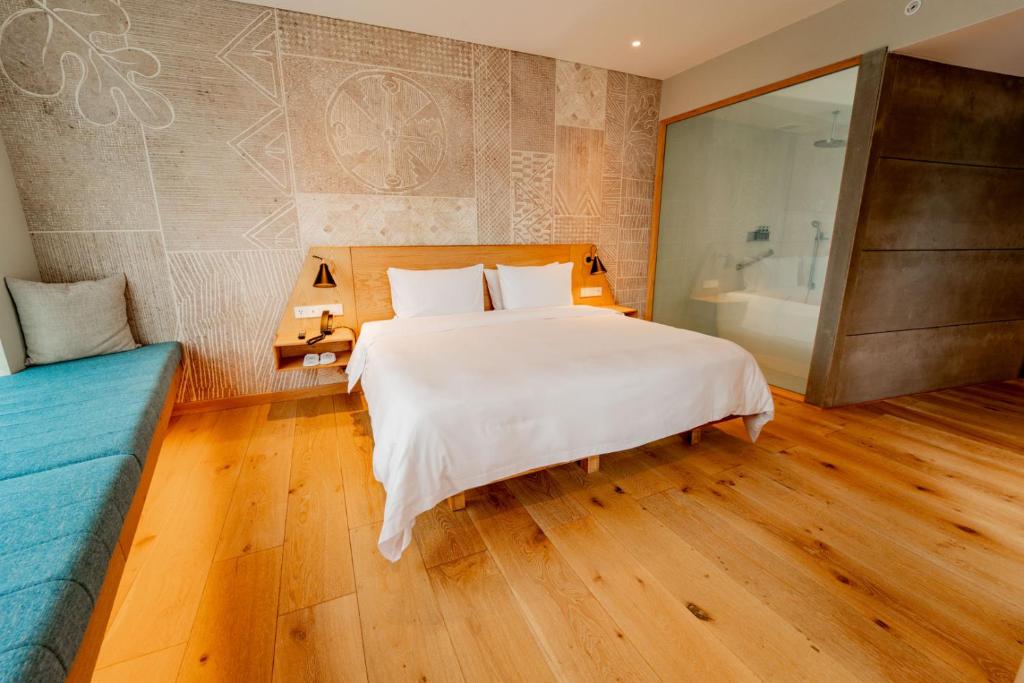 Postel nebo postele na pokoji v ubytování GO Quito Hotel