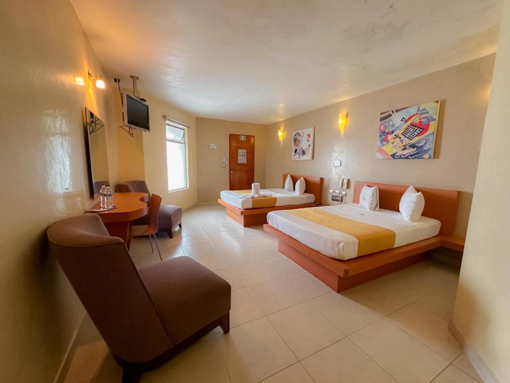 Postel nebo postele na pokoji v ubytování Auto Hotel Mediterráneo
