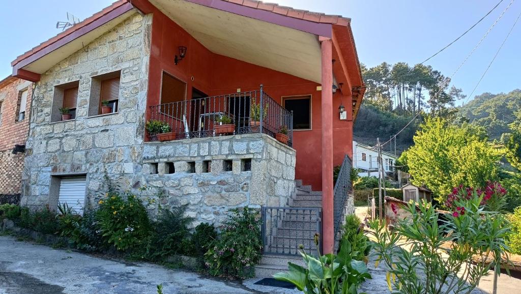 a house with a staircase in front of it at Casa Quintela in Ourense