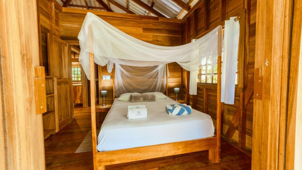Postel nebo postele na pokoji v ubytování Casa Viva Lodge