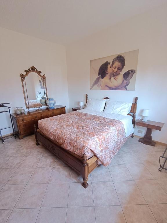 Postel nebo postele na pokoji v ubytování B&B Il Melograno