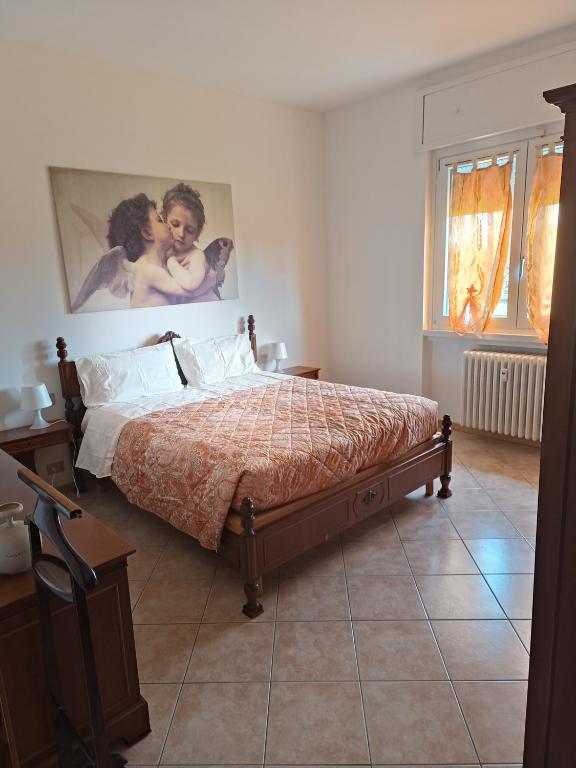 Postel nebo postele na pokoji v ubytování B&B Il Melograno
