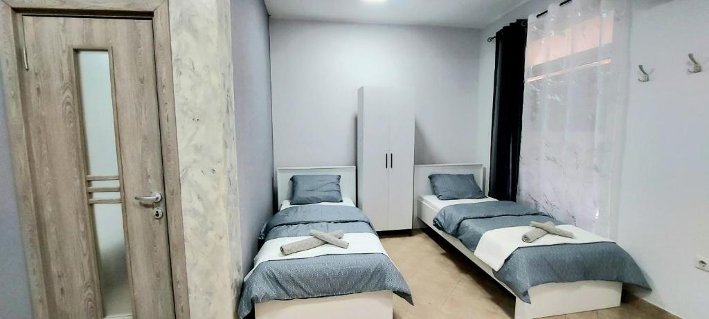 Postel nebo postele na pokoji v ubytování Apartman SPLENDID
