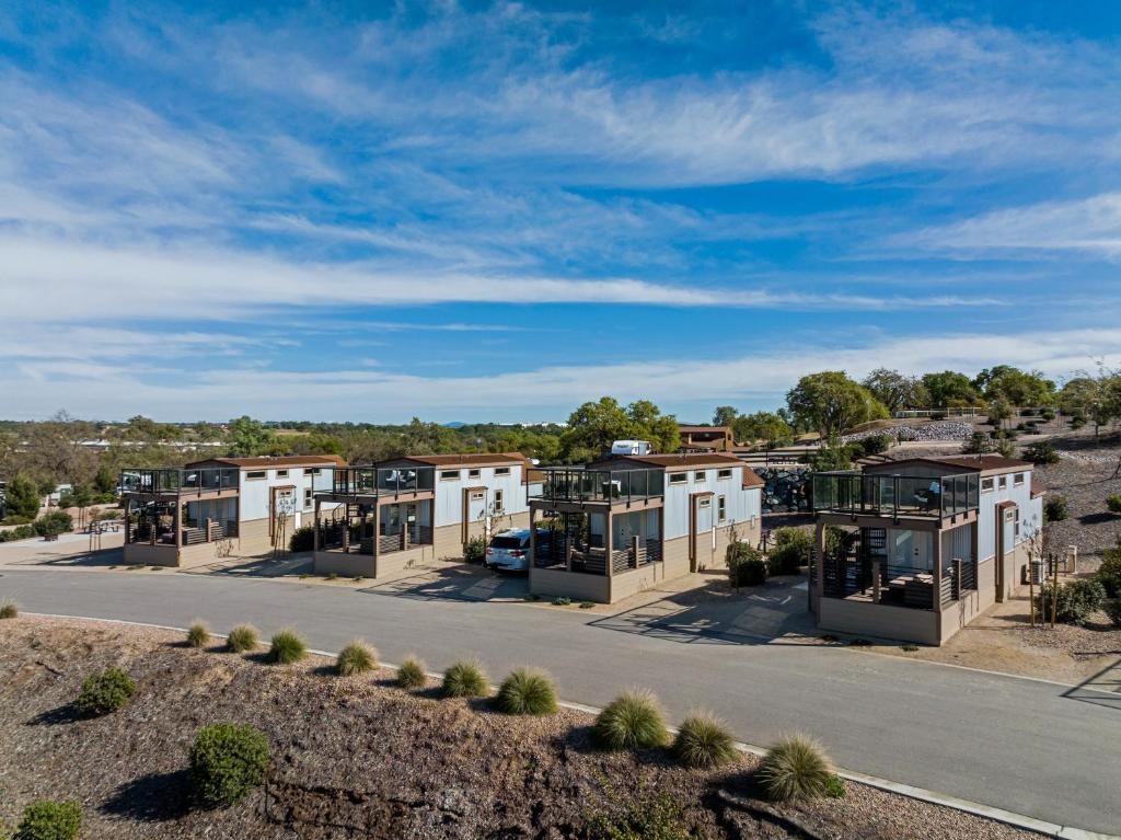 a row of modular homes on a road at Sun Outdoors Paso Robles in Paso Robles