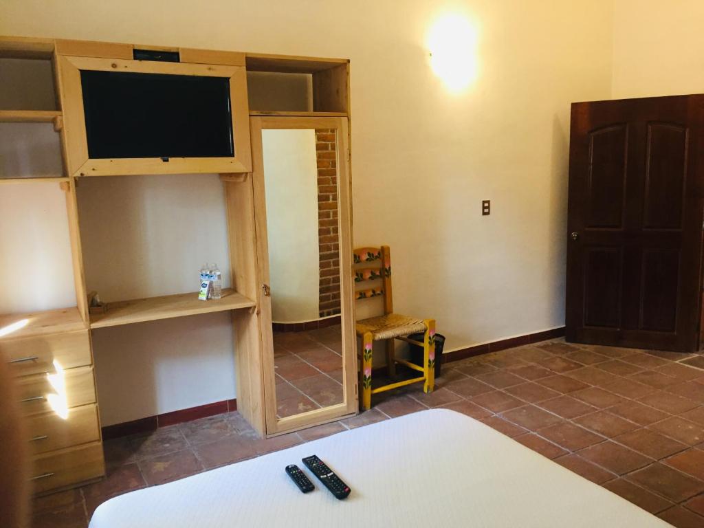 Postel nebo postele na pokoji v ubytování HOTEL EX HACIENDA EL MOLINO