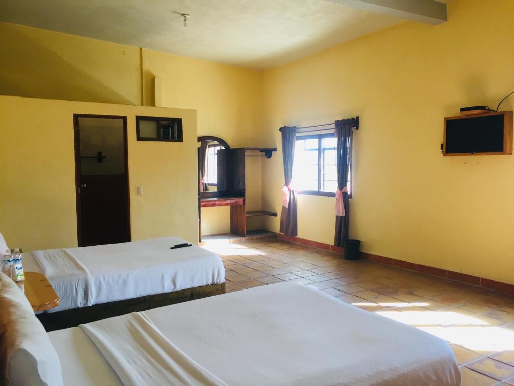 Postel nebo postele na pokoji v ubytování HOTEL EX HACIENDA EL MOLINO