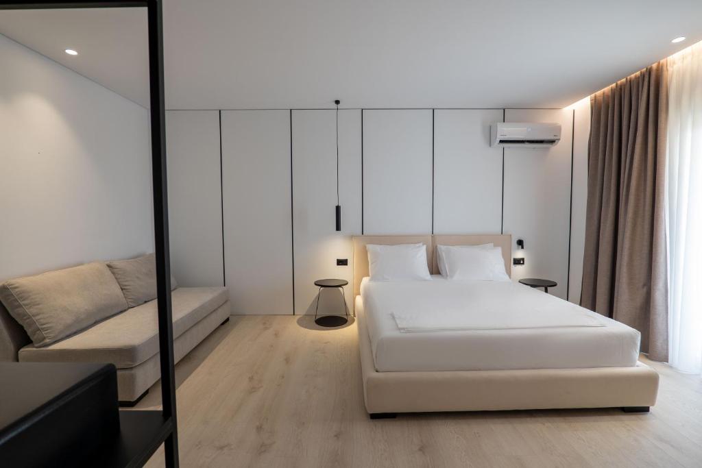 Postel nebo postele na pokoji v ubytování Arrei Hotel
