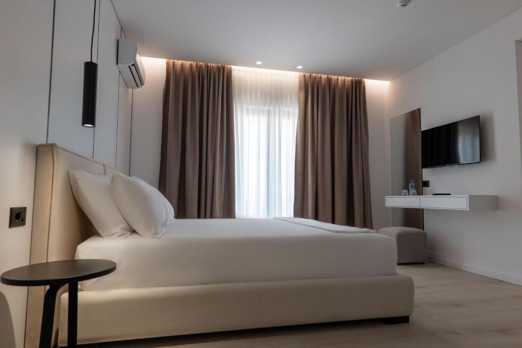 TV a/nebo společenská místnost v ubytování Arrei Hotel