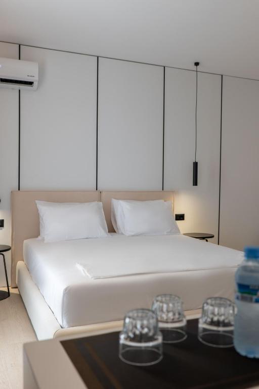 Postel nebo postele na pokoji v ubytování Arrei Hotel
