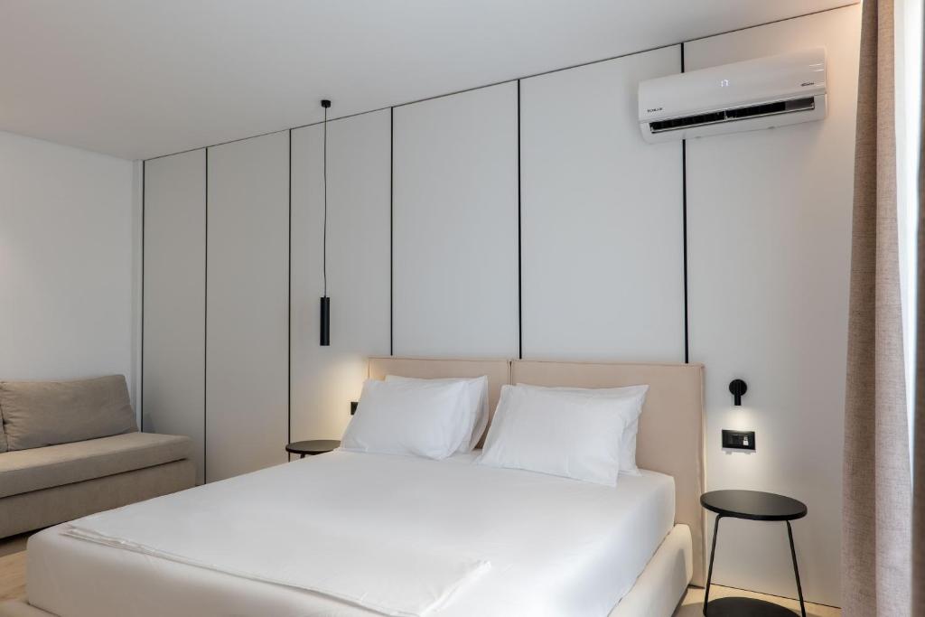 Postel nebo postele na pokoji v ubytování Arrei Hotel