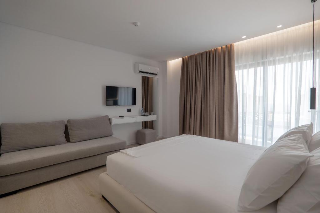 Postel nebo postele na pokoji v ubytování Arrei Hotel
