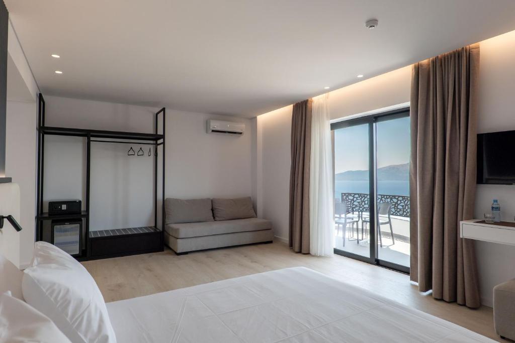 Postel nebo postele na pokoji v ubytování Arrei Hotel