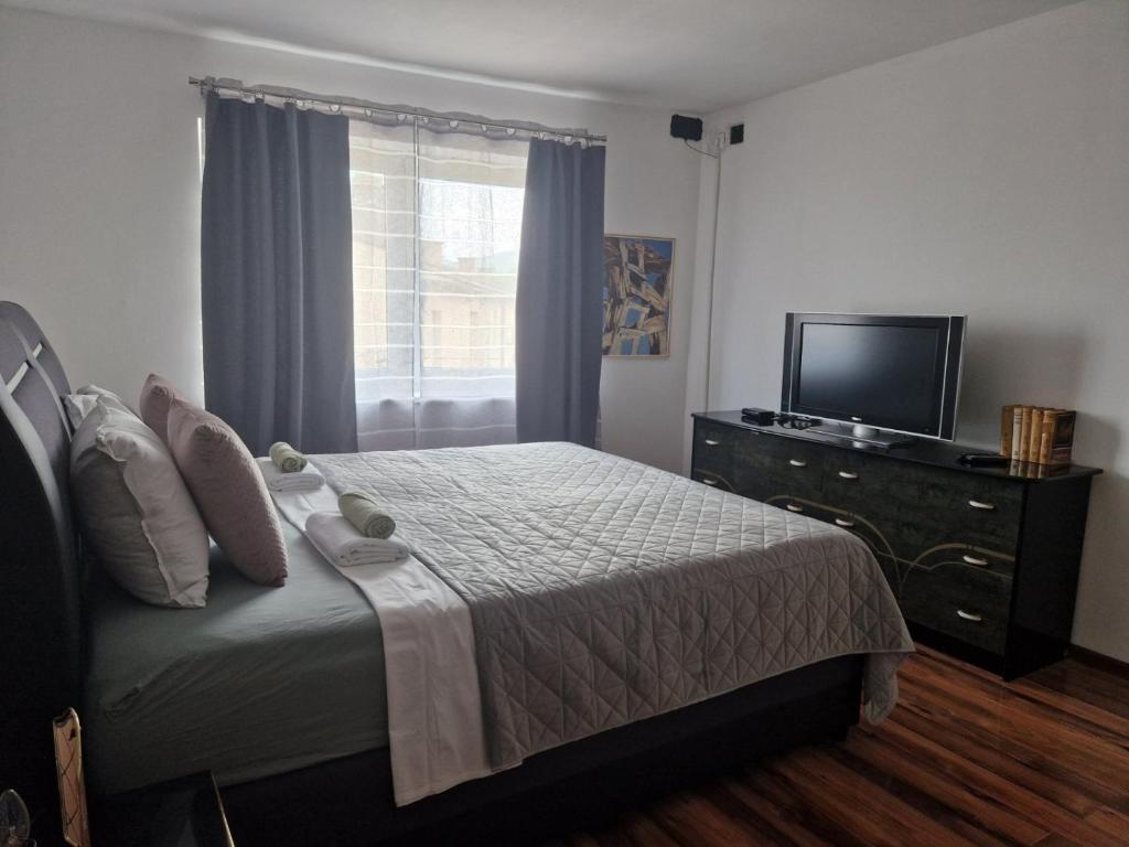 Postel nebo postele na pokoji v ubytování Apartman Galerija
