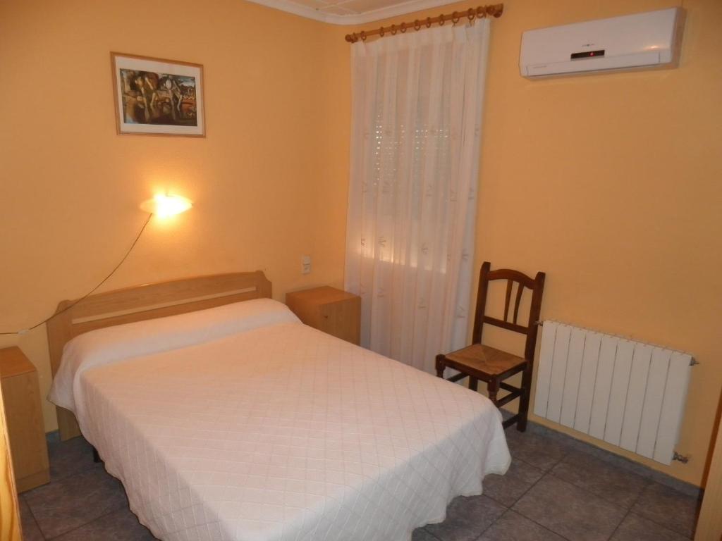 Posteľ alebo postele v izbe v ubytovaní Hostal Alba