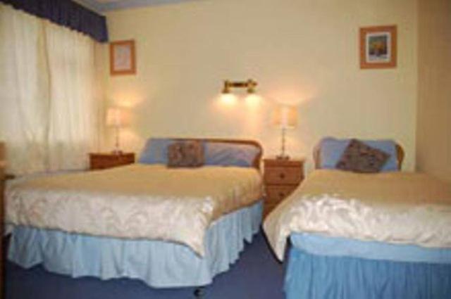 Postel nebo postele na pokoji v ubytování Seashore Lodge Guesthouse