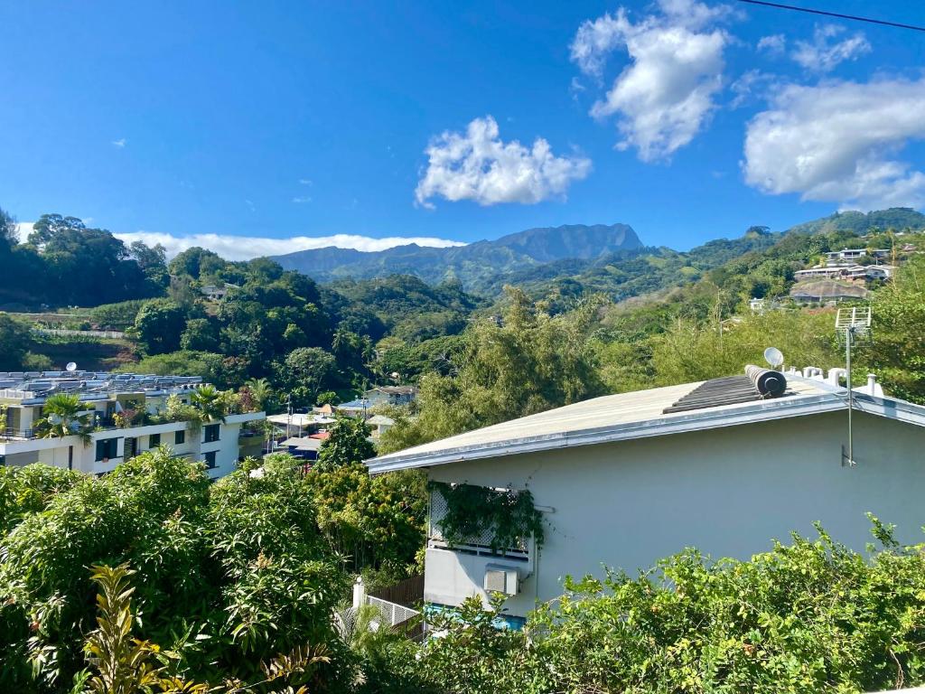 a view of the mountains from a house at Heiata Lodge Papeete in Papeete