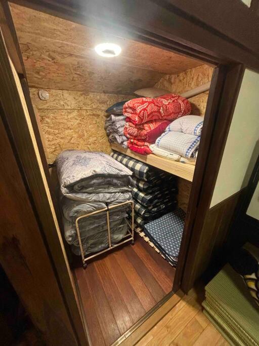 Postel nebo postele na pokoji v ubytování 昭和体験宿Rin
