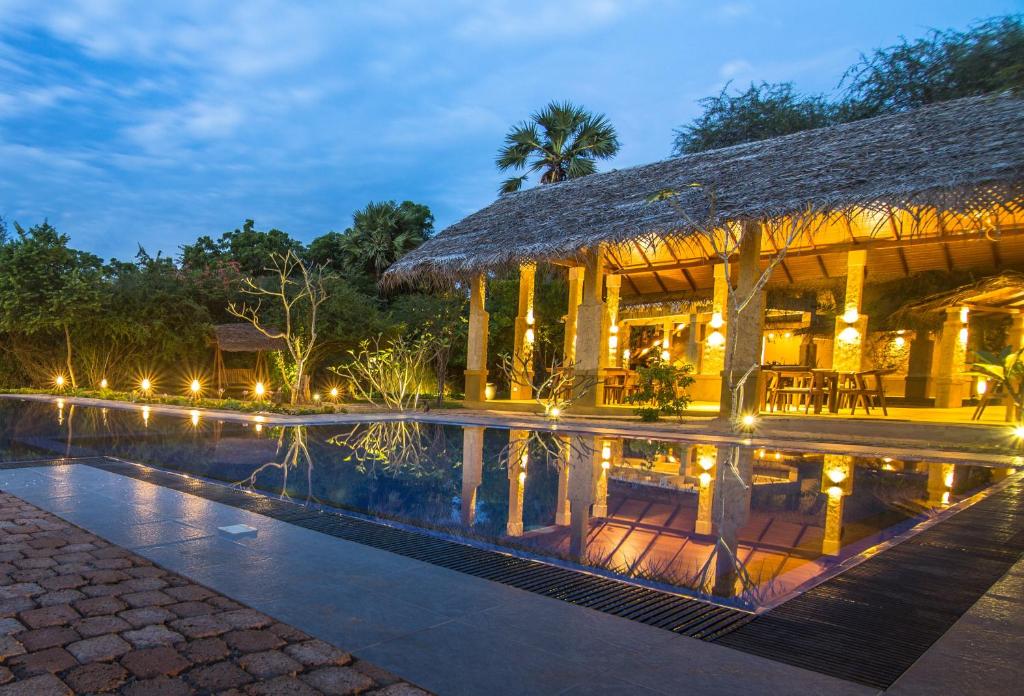 a villa with a swimming pool at night at Cloud Nine Wilpattu by Aaradhya in Wilpattu