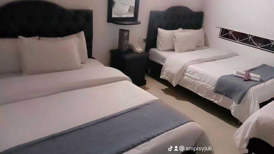 Postel nebo postele na pokoji v ubytování hotel laguna 24