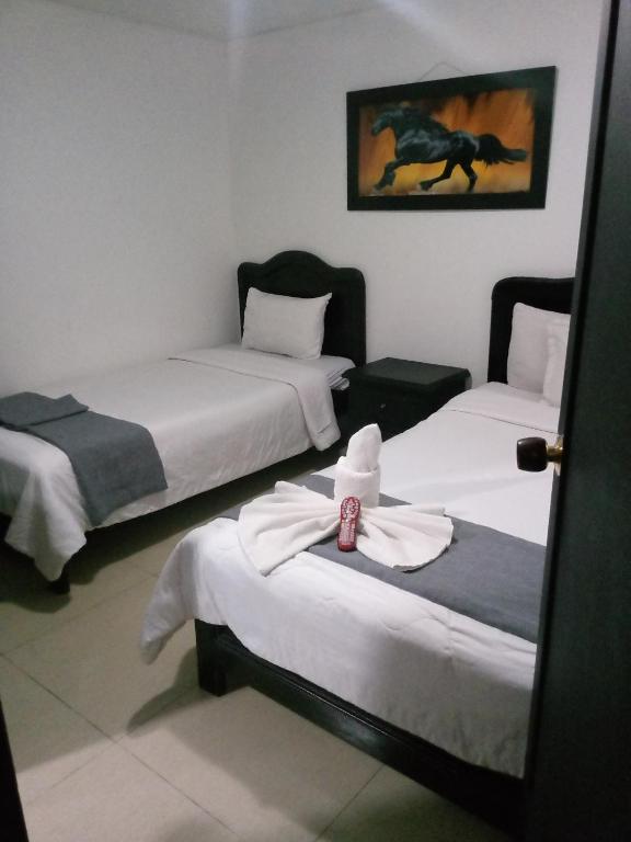 Postel nebo postele na pokoji v ubytování hotel laguna 24