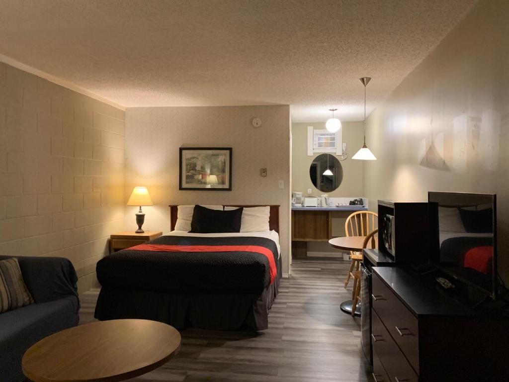 Postel nebo postele na pokoji v ubytování Motel Bavaria